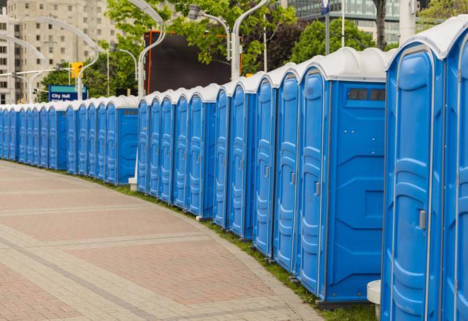 a row of portable restrooms at an outdoor special event, ready for use in El Mirage